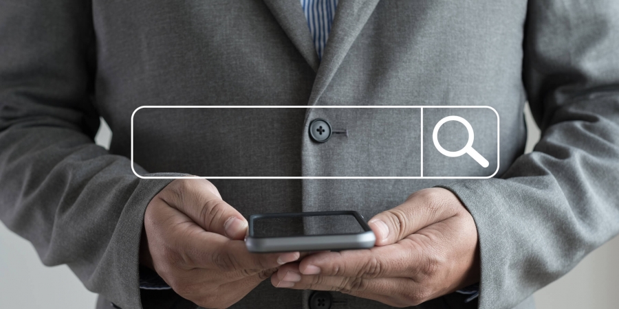 Business executive using a smartphone to search for a CTO