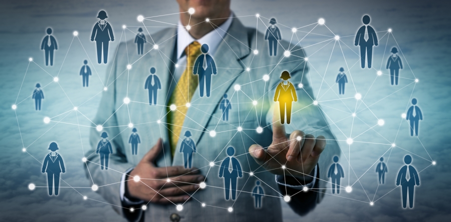 Job recruiter holding a yellow light, symbolizing opportunity, surrounded by people connected to him in a networking context.